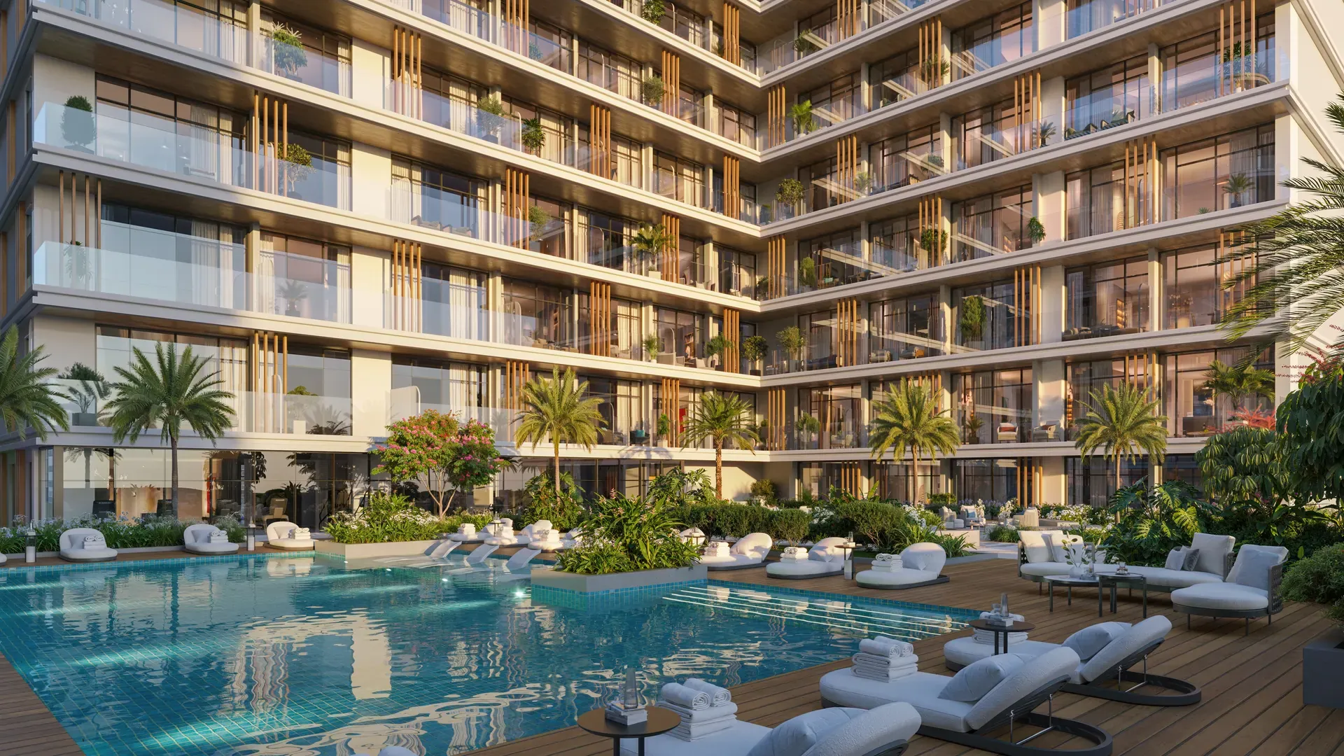 Pool and sun loungers within the landscaped gardens